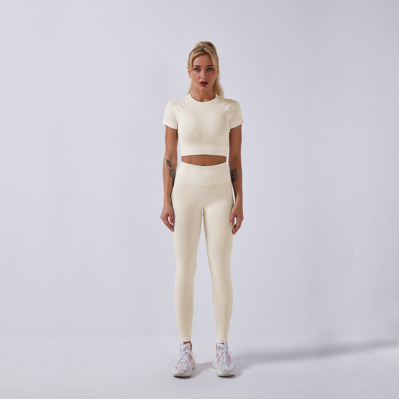 Women wearing women's seamless yoga set in cream color for fitness and exercise.